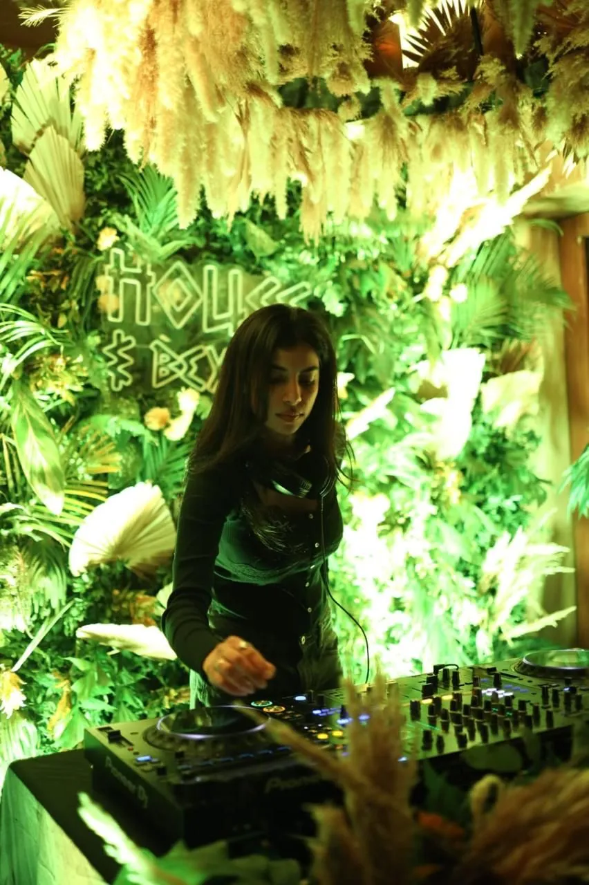 Tropical Jungle–Themed Bar Décor with DJ Setup