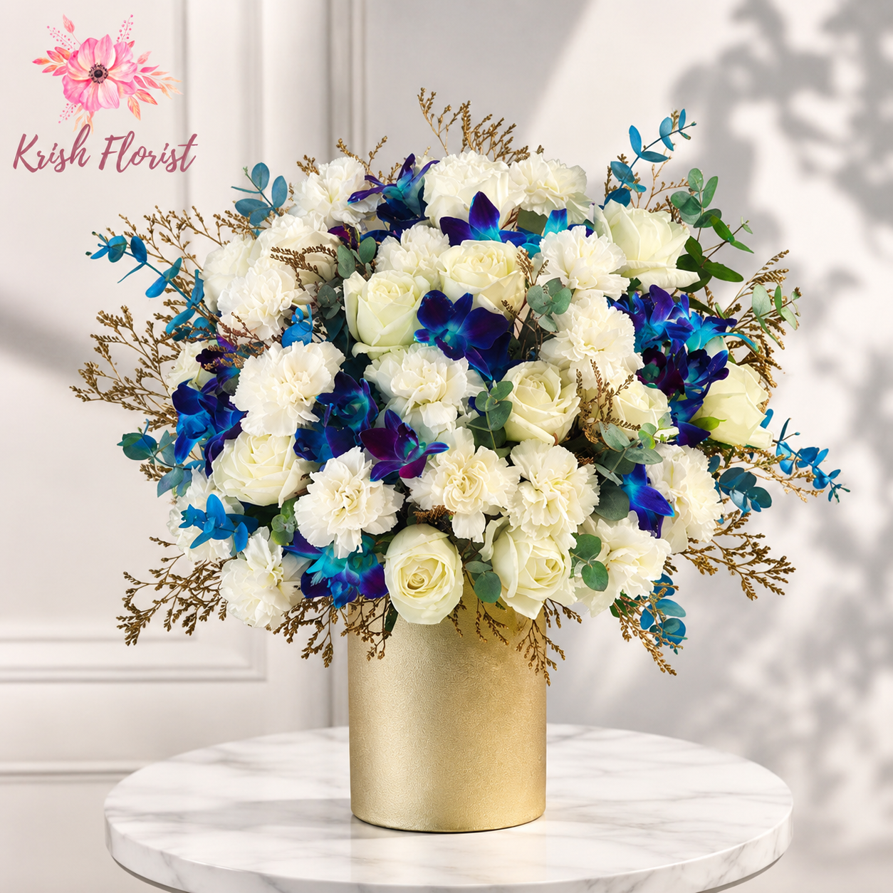 Elegant luxury flower box featuring fresh white roses and premium blue orchids, beautifully arranged for a sophisticated floral gift. Ideal for birthdays, anniversaries, corporate gifting and special occasions with flower delivery across Delhi by Krish Florist.